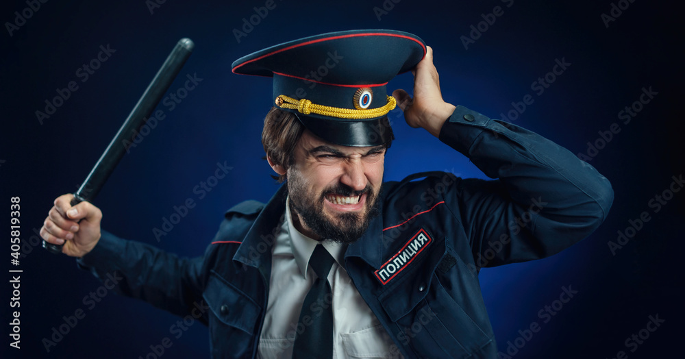 a man in a Russian police uniform with a baton. English translation of "  Police" Stock Photo | Adobe Stock