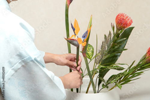 Japanese woman who does flower arrangement (Ikebana)