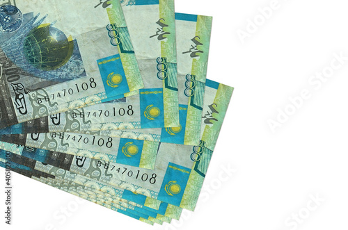 500 Kazakhstani tenge bills lies in small bunch or pack isolated on white. Mockup with copy space. Business and currency exchange photo