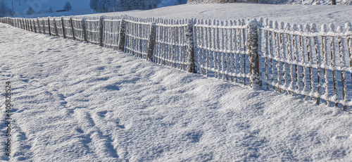 Fence covered snow 
