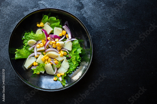 potato salad with corn lettuce and vegetables ready to eat on the table for healthy meal snack outdoor top view copy space for text food background image rustic keto or paleo diet