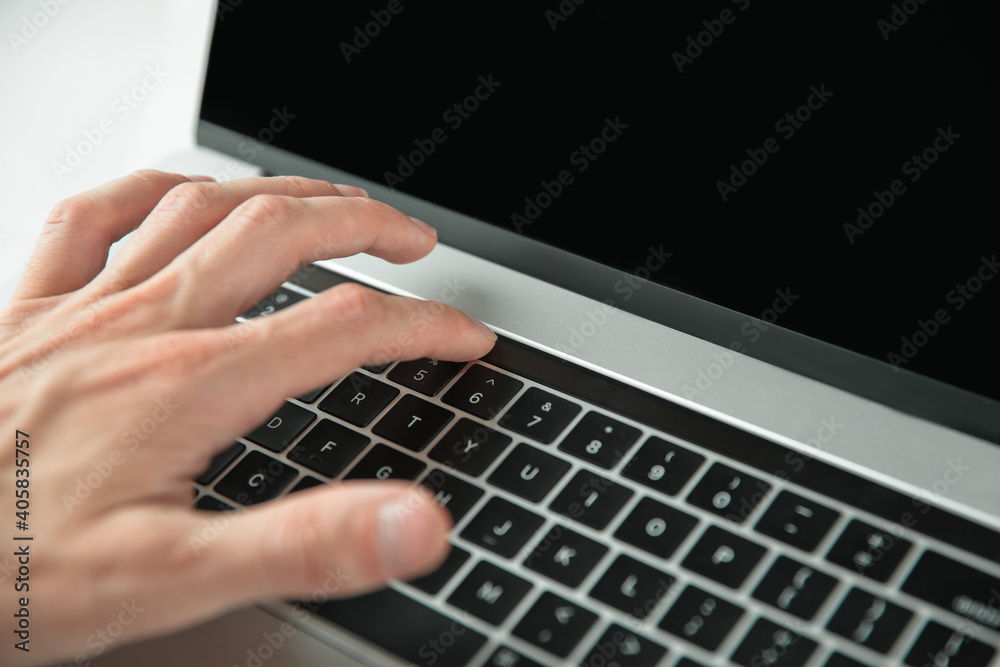 close up. man using the optional touch panel of his laptop. close up. man using the optional touch panel of his laptop.