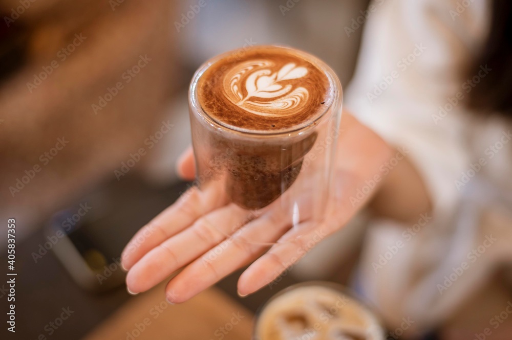 A young happy woman enjoying and relaxing in coffee shop A young happy woman enjoying and relaxing in coffee shop