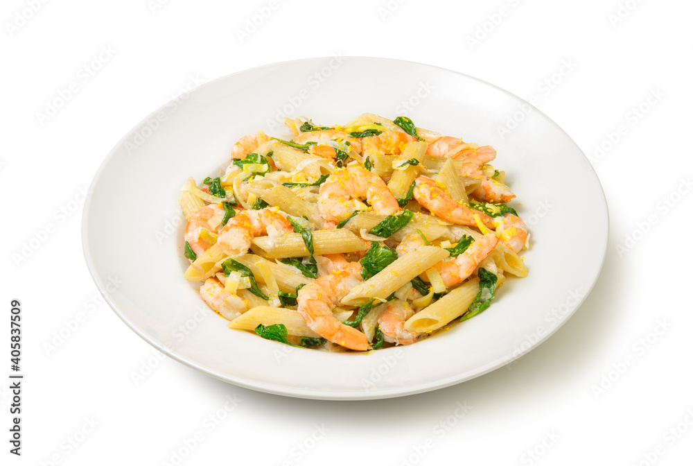 Pasta with shrimps, leeks and spinach in a white plate, Isolated on white background. Close-up. Pasta with shrimps, leeks and spinach in a white plate, Isolated on white background. Close-up.