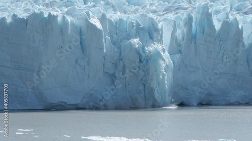 Glacier calving falling down in Patagonia Argentina in slow motion