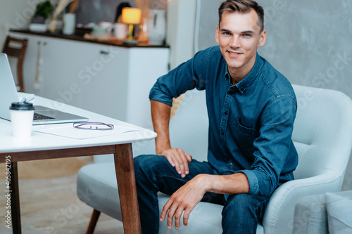 creative young man sitting in a home office.