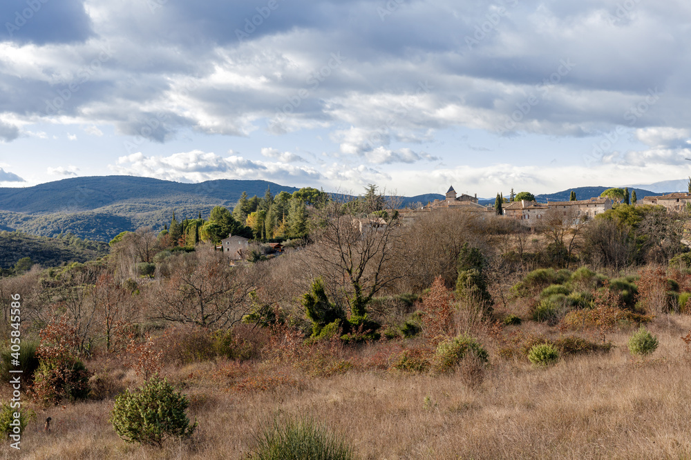 Landscape in Ardeche, france. Mountains begind a village.