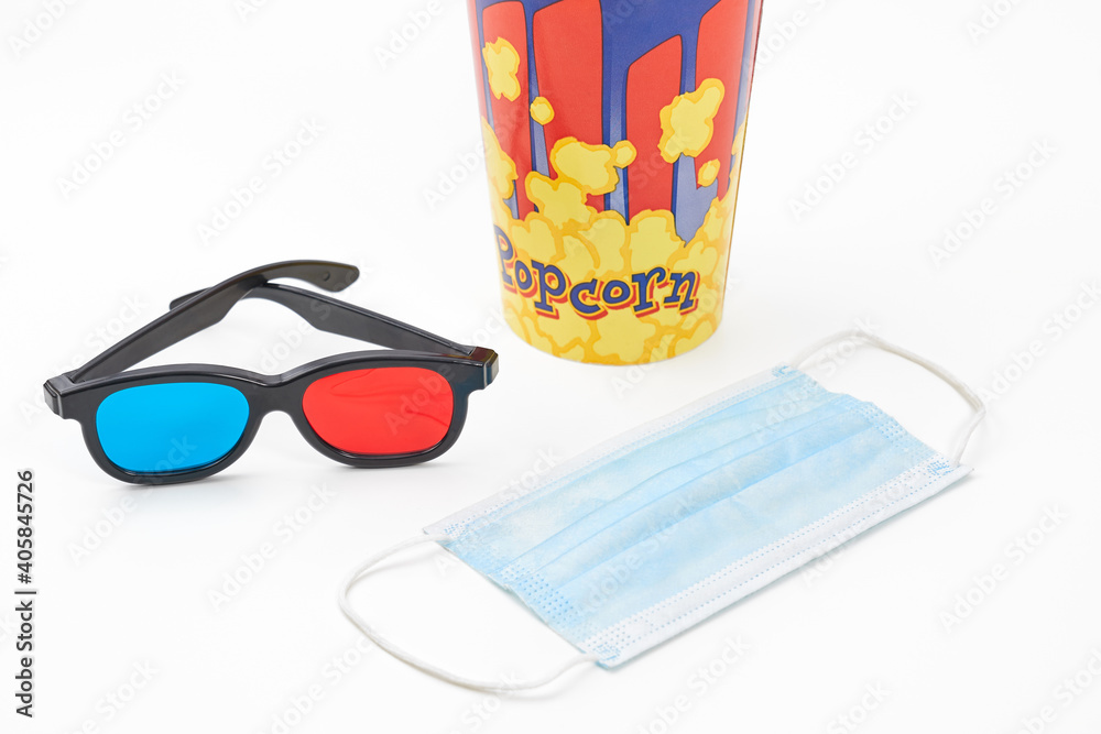 Carton cup for popcorn, 3d glasses and mask on white background. Carton cup for popcorn, 3d glasses and mask on white background.
