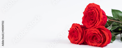 Bouquet of red roses and hearts on a white background. Valentine s day February 14. Place for your text.