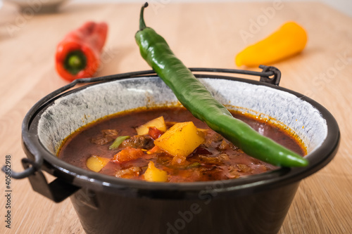 Hungarian Goulash or Gulyas Served in a Small Cauldron photo