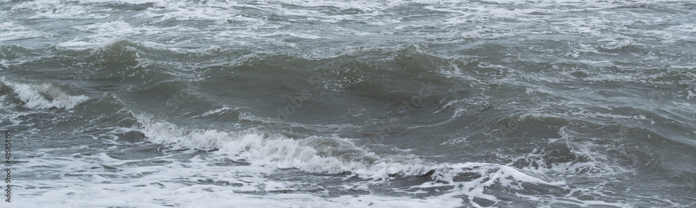 Winter seascape background, splashing water waves