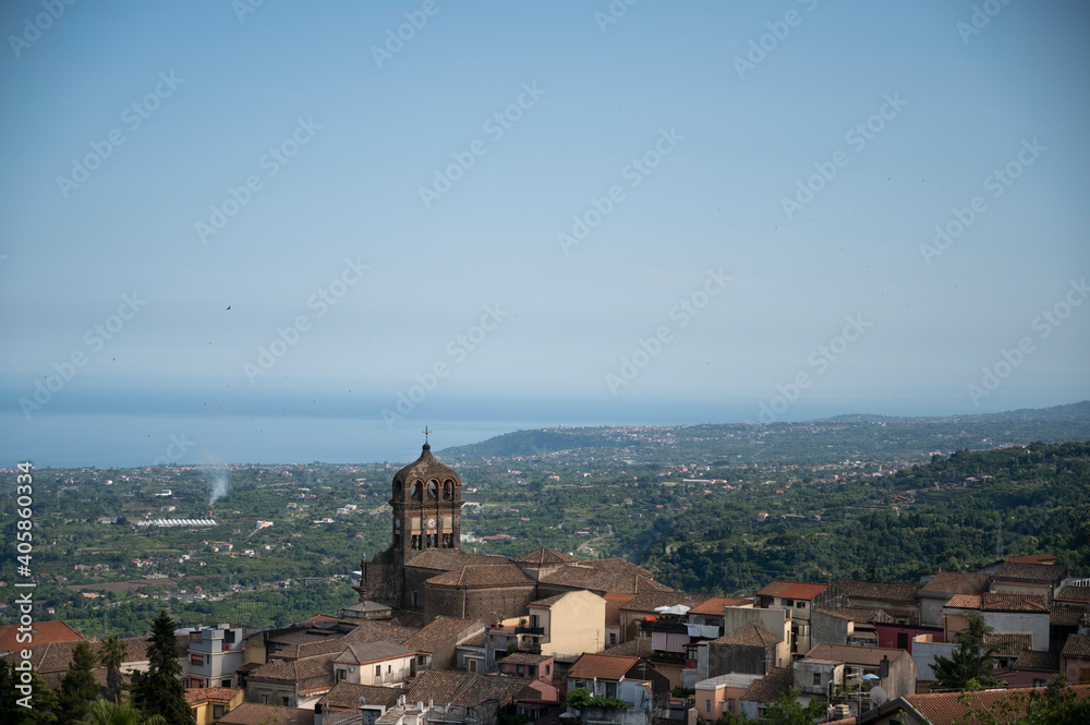 View of the village of Sant 'Alfio from the top of the Etna volcano with the Ionian coast in the background in Sicily