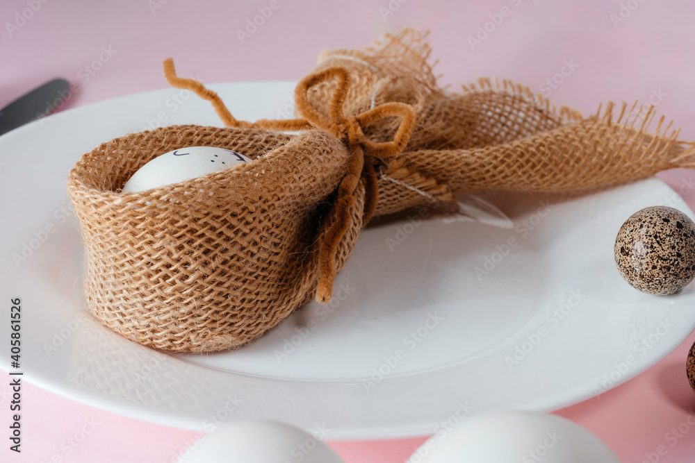 Fototapeta premium Easter table setting on light bink background