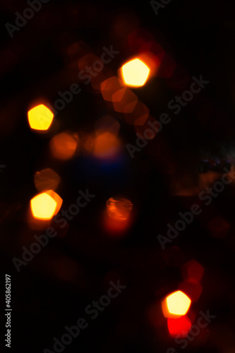 On a black background, gold yellow and white lights
