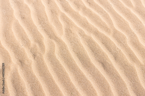 Wavy sand close up. Perfect photography for a wallpaper use. Summer atmosphere.
