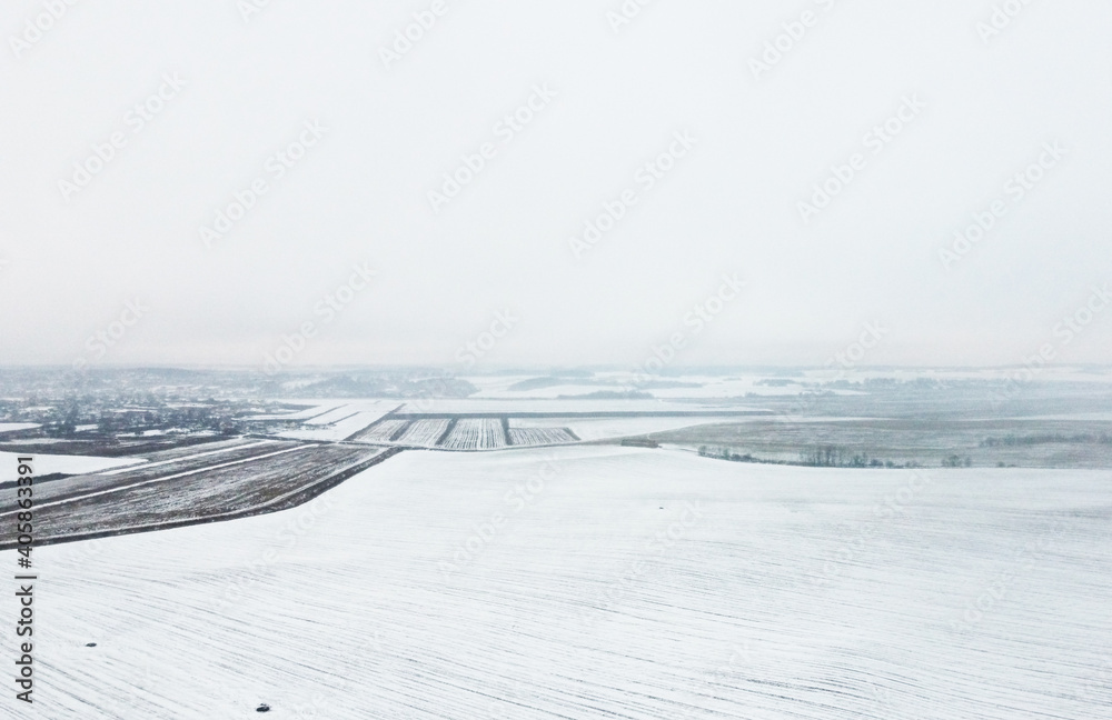 Top view of winter snow agro field