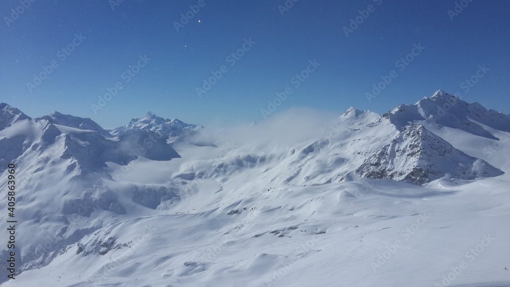 Magnificent view of the snow-white tall mighty mountains Elbrus, ski resort, the Republic of Kabardino-Balkaria, Russia