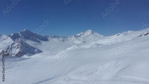 Magnificent view of the snow-white tall mighty mountains Elbrus, ski resort, the Republic of Kabardino-Balkaria, Russia © dolphinartin