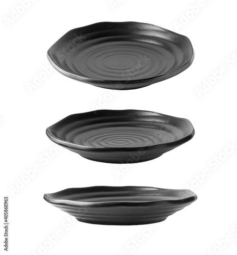 Black plate isolated on white background with different angle of view