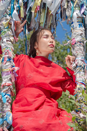 A girl of Buryat appearance on Lake Baikal photo