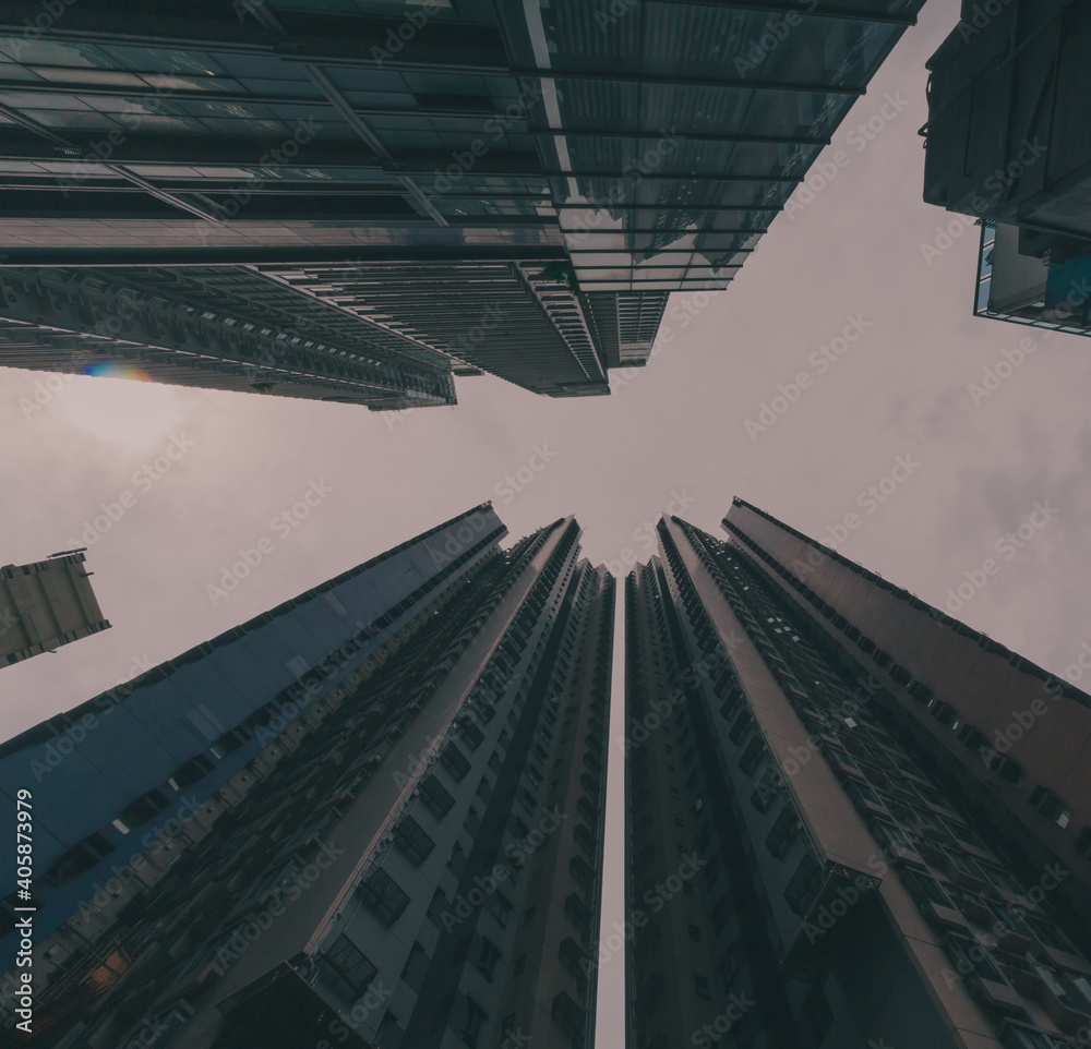 Wide angle picture of Hong Kong buildings from below. Low shot.