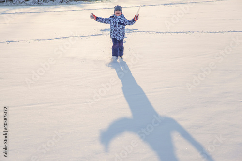 a boy playing in fresh snow