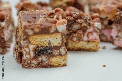 A marvelous mix of sultanas  marshmallows  biscuit pieces  crispy rice and glac   cherries covered in milk chocolate