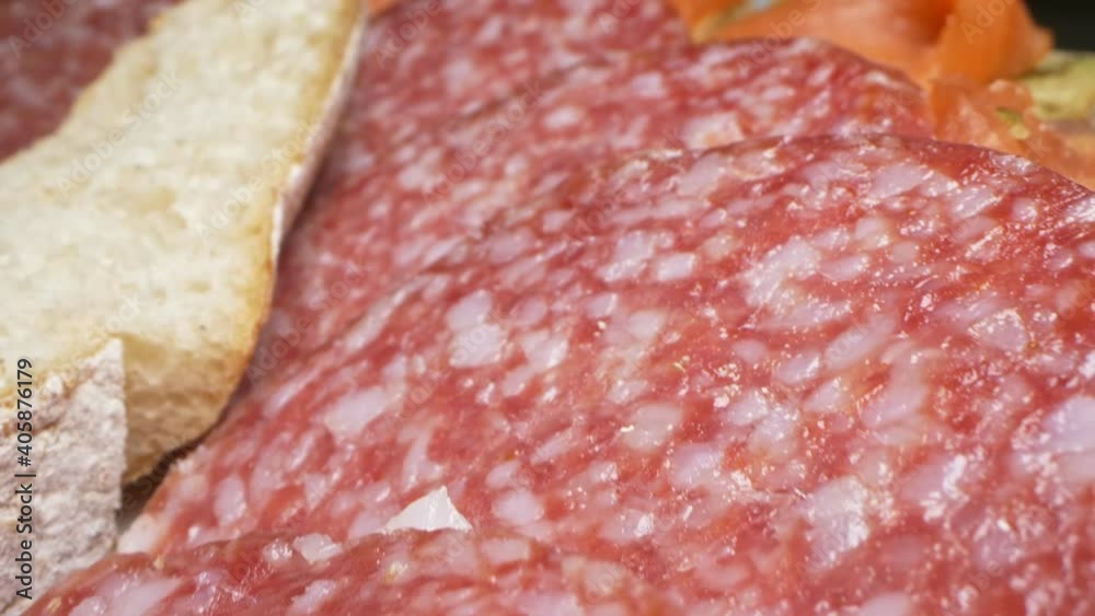 extreme close-up, detailed. sandwiches with fish and sausage on a platter. extreme close-up, detailed. sandwiches with fish and sausage on a platter.