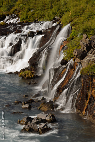 Fototapeta Naklejka Na Ścianę i Meble -  Hraunfossar waterfalls cascading into the Hvítá river over ledges of lava rock