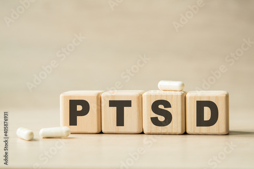 PTSD. THE WORD WRITTEN ON CUBES, PILLS . MEDICAL CONCEPT