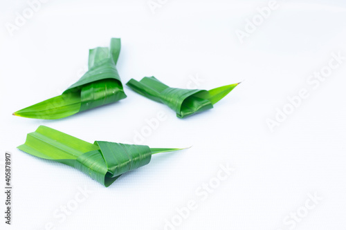 fresh pandan leaf knots isolated on the white background, perspective view