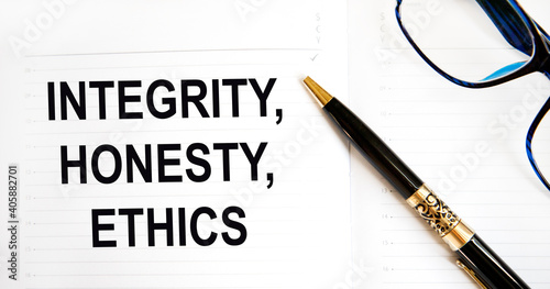 In the diary, the text of INTEGRITY, HONESTY, ETHICS, is a pen nearby.