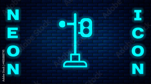Glowing neon Train traffic light icon isolated on brick wall background. Traffic lights for the railway to regulate the movement of trains. Vector.