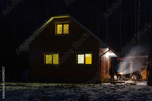 Lighting in the windows of the night house