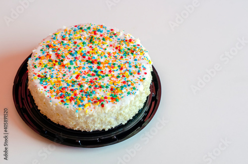 Vanilla white birthday cake with decorative sprinkles