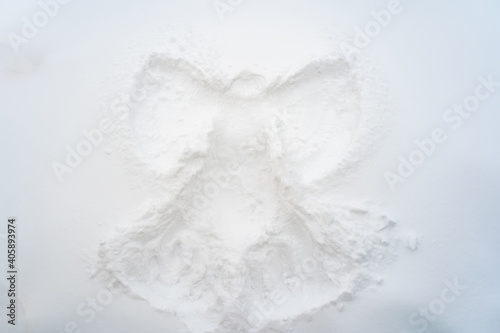 Fototapeta Naklejka Na Ścianę i Meble -  Winter holiday snow angel, top view