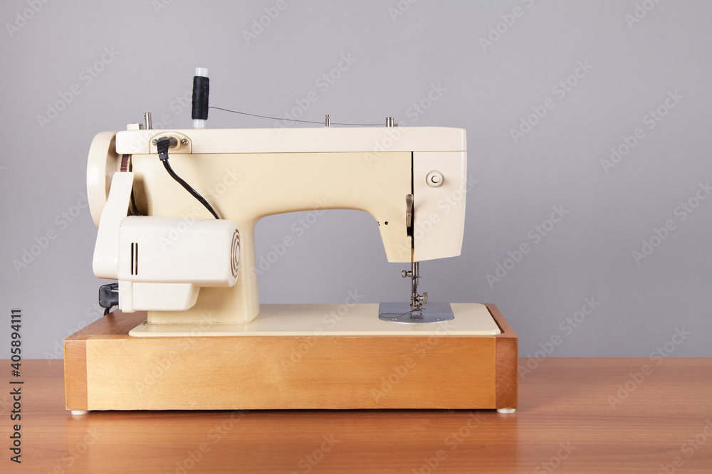 Sewing machine on an isolated table.