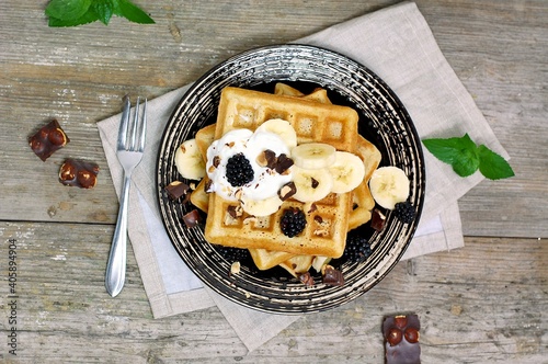 Whole grain waffles with chocolate, banana, cottage cheese, milk, coffee