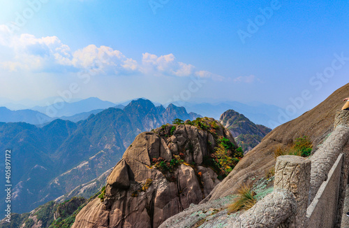 Scenic and panoramic view of Mount Huangshan cliffs and forest of Masson pine with various colours typical of the autumn season, Anhui, China Yellow mountain photo