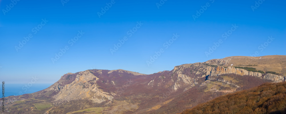 mountain plateau under blue cloudy sky, natural landscape