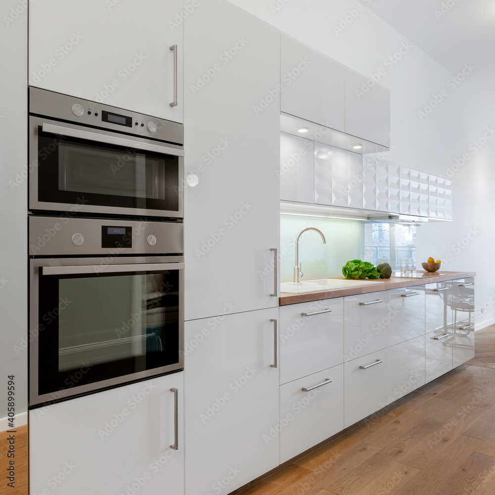 Small kitchen with white furniture