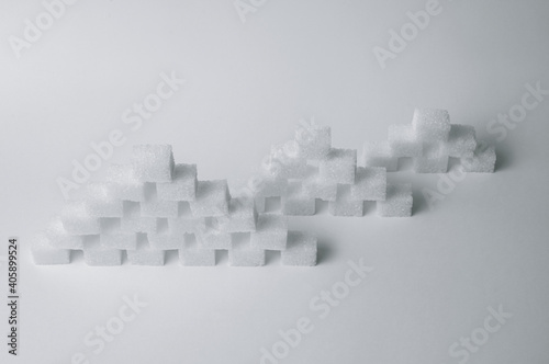Refined sugar cubes on white background