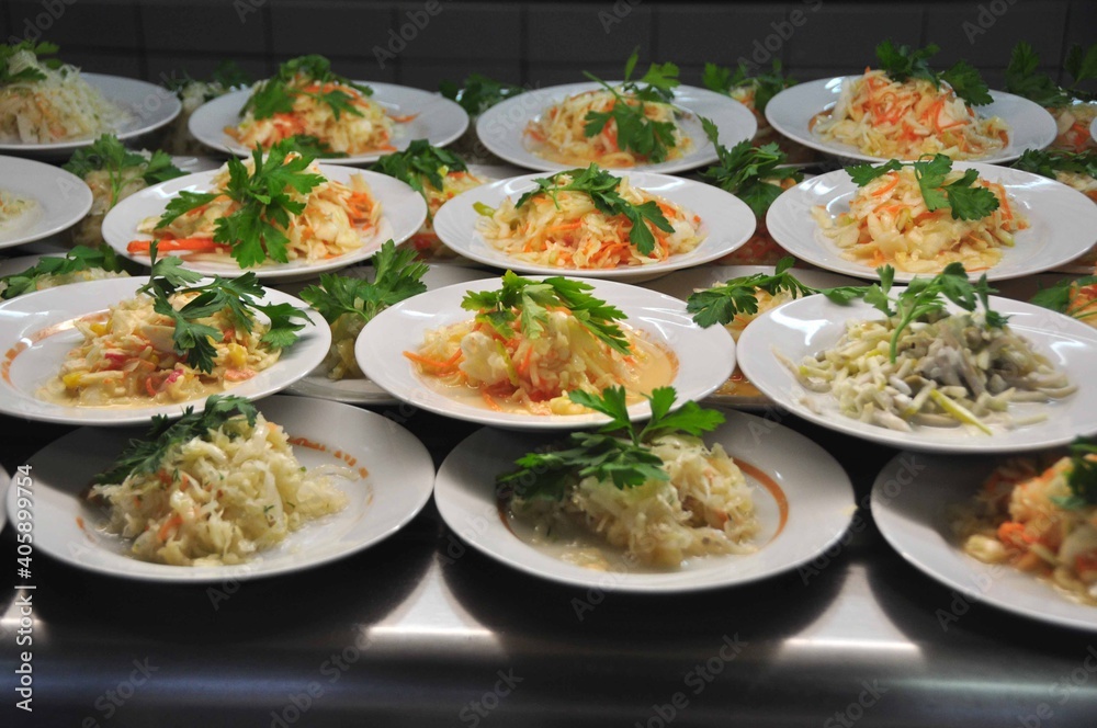 Plates of Fresh Salad with Greens Ready for Service Plates of Fresh Salad with Greens Ready for Service