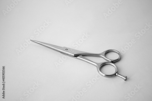 Hairdressing scissors for cutting hair on a white background.