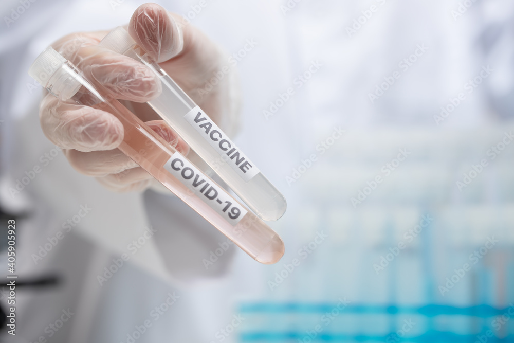 Macro shot of biological tubes with covid-19 vaccine on laboratory background. Backstage of scientific discovery. Healthcare concept. Vaccination. News feed. Macro shot of biological tubes with covid-19 vaccine on laboratory background. Backstage of scientific discovery. Healthcare concept. Vaccination. News feed.