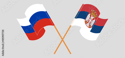 Crossed and waving flags of Russia and Serbia