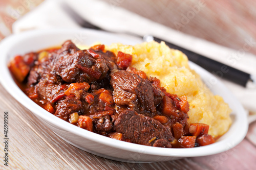 Delicious beef stew with mushrooms and polenta. High quality photo