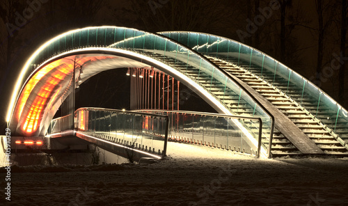 Bridge in the People's Park in Lublin illuminated with LED light - red