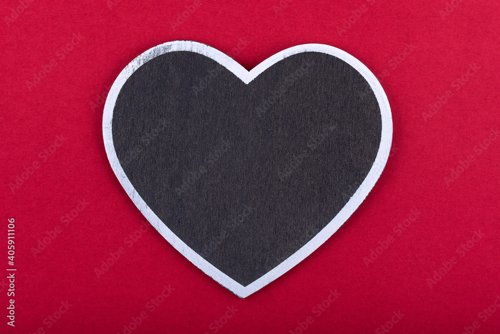 Obraz premium Black chalkboard with heart shape on red background. free copy space. Concept valentine's day. Concept mother's day