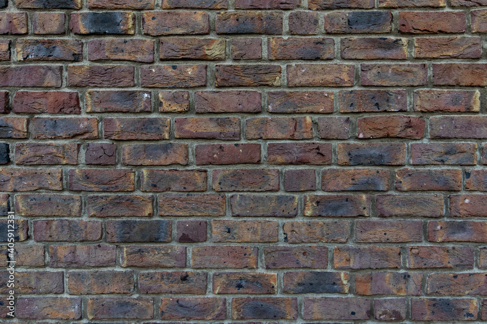 Close up of an old red orange brown worn and weathered brick wall, clinker bricks. Brick texture Close up of an old red orange brown worn and weathered brick wall, clinker bricks. Brick texture